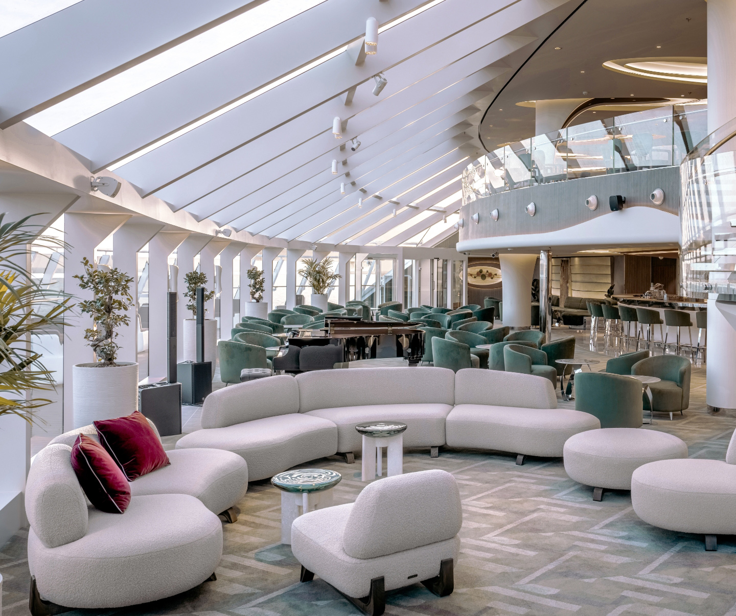 Experience luxury in the exclusive Top Sail Lounge, a private retreat for Yacht Club members on MSC Cruises. The lounge features plush white leather sofas, abundant natural light, and stunning panoramic views.